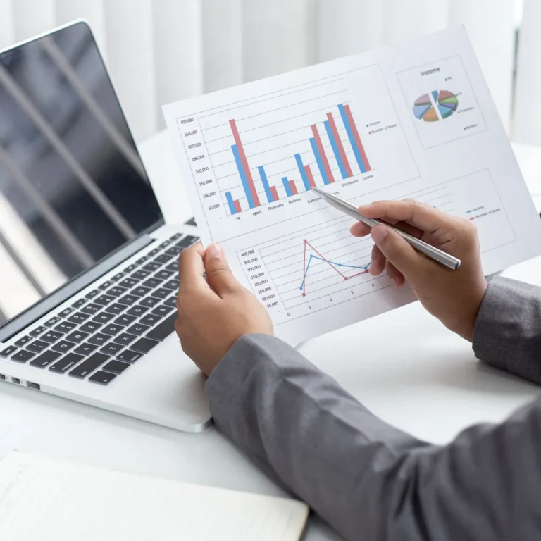 Finance consultant analyzing business data through charts